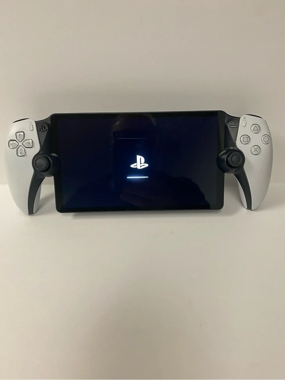 Sony PlayStation Portable-style Handheld with White Side Controllers